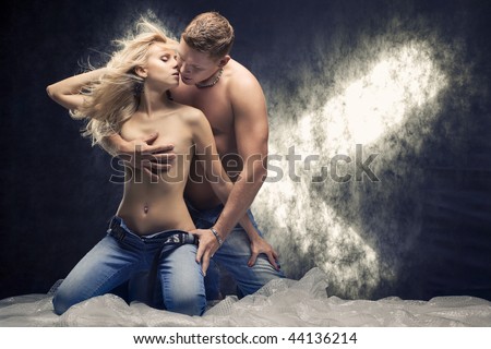 stock photo Young sexy couple in a studio Toned stock photo Young sexy couple in a studio Toned
