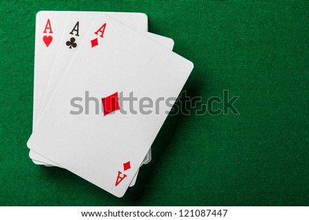 Cards and pack of playing cards on the table.