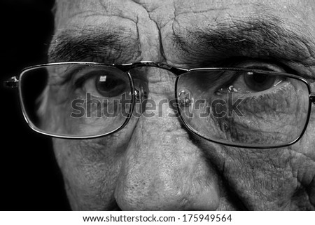 portrait of an elderly man on black background