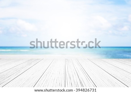 wood floor background blurred ocean beach abstract style.Light center of the image concept, ideas differ.