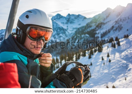 Young skier sitting in cabin on ski resort. Alps, Austria