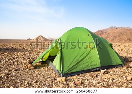Green tent in sunny morning