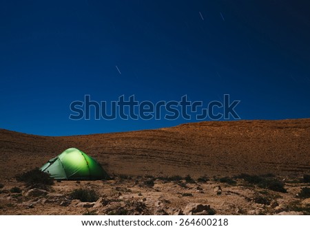 Illuminated tent at night. Camping at night