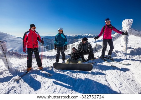 Happy friends having fun in Mountains ski resort - nature and sport picture