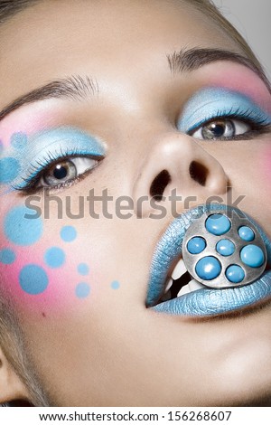 girl with funny make up and the ring in the lips