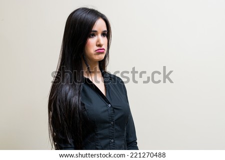 Beautiful Latin Girl showing sad funny expression
