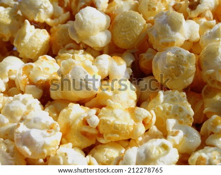 delicious sweet popcorn golden color close up on the outdoor cinema in the afternoon useful for food background