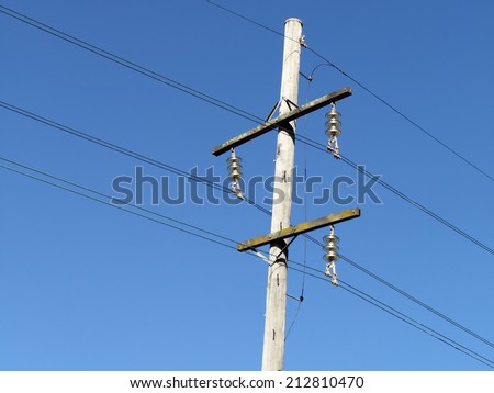 urban area power lines in dark blue sky close up for electricity network and technology improving