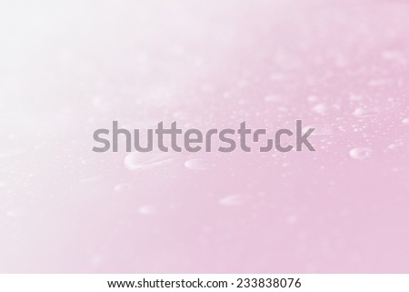 water drops glow shiny bright light pink background