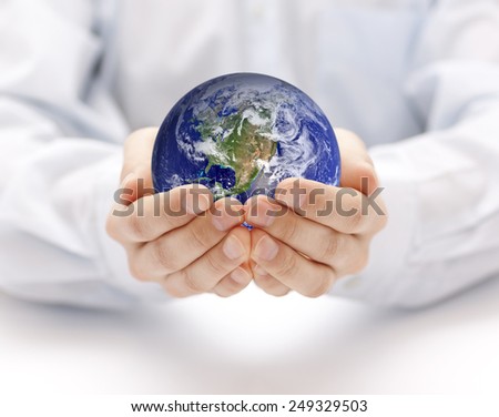 Earth in hands. Earth image provided by Nasa.