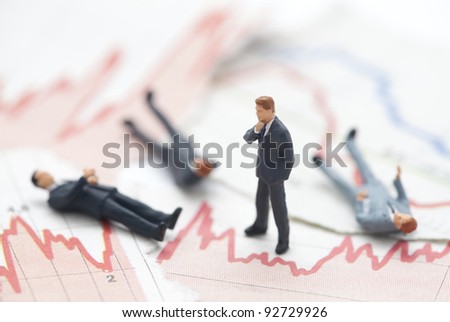 Financial crisis. Figures of businessman on financial charts