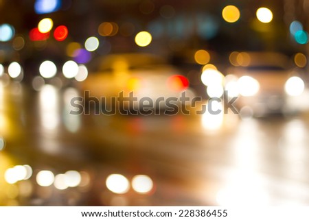 Lighting cars on defocused in the road at night for background