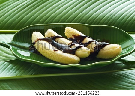 banana and chocolate on banana leaf plate, and leaves background