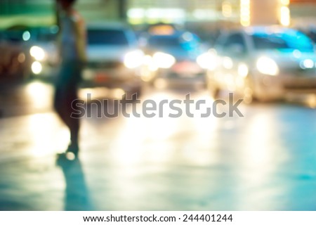 abstract people walk street at night in the city, colorful and blur concept