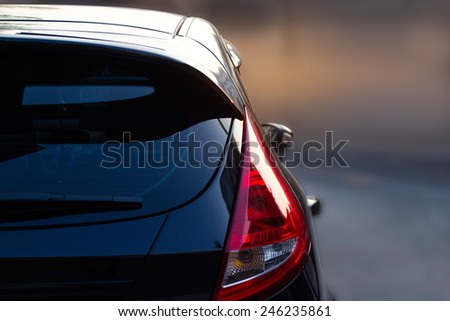 Back light of city car on the street background