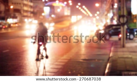 abstract bike on colorful street light at night in the city, soft and blur concept