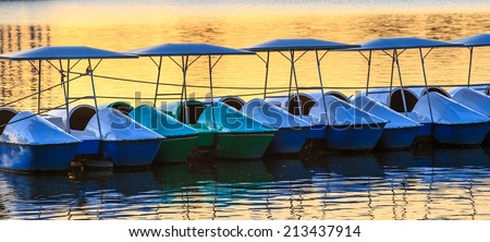 Water cycle boats in a lake. This photo is taken at a public park.