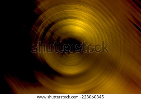 Abstract background of spin circle radial motion blur in metallic yellow gold effect