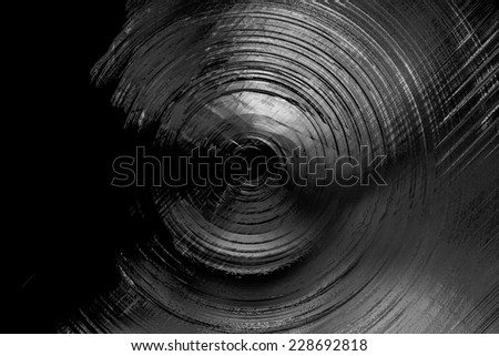 Abstract background of spin circle radial motion blur in black, grey, and white with metallic effect