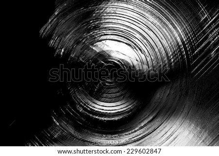Abstract background of spin circle radial motion blur in black, grey, and white with metallic effect