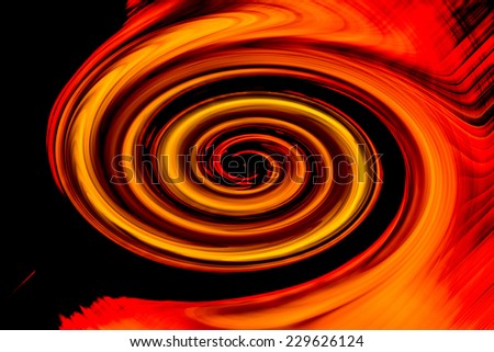 Abstract background of motion blur twirl in metallic gold, red, orange, and yellow, in dark background