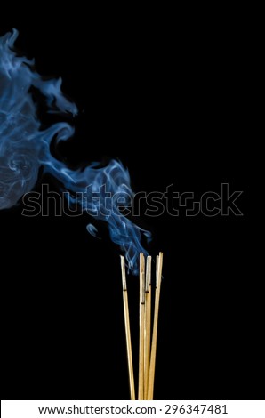 Incense Stick with Smoke on Black Background.