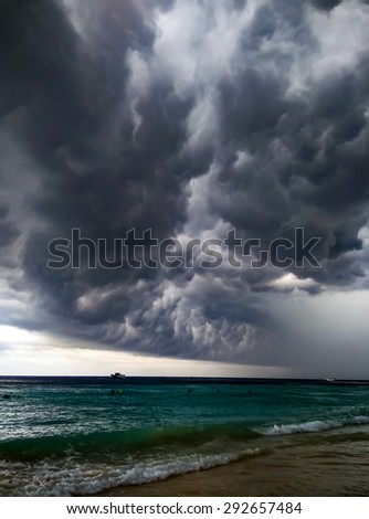 Dark rain clouds look awesome at the beach.