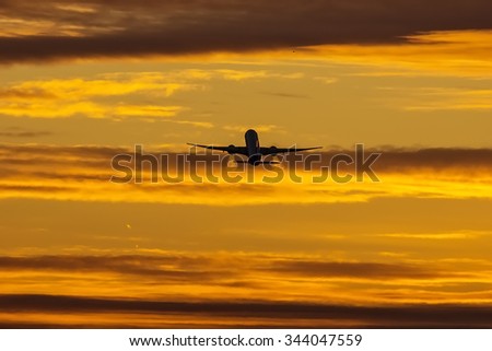 The airplane takes off at dawn.