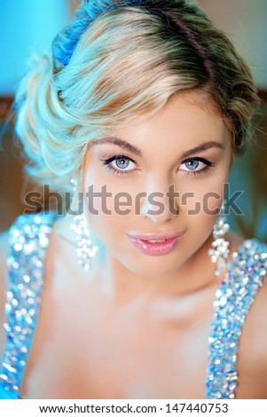 Luxury woman in fashionable dress in expensive interior