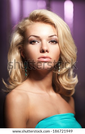Cute face of a beautiful young woman. Portrait of fashionable modern girl blonde.