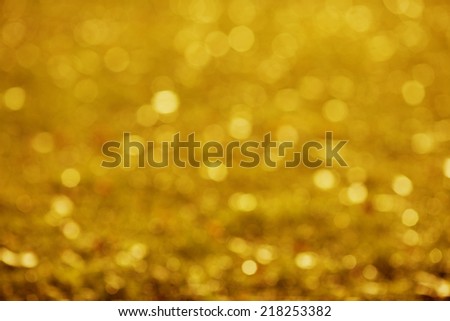 Autumn, fall background. Gold abstract bokeh defocused lights blury nature.