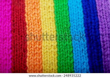 Background from knitted rainbow. texture of wool products. Comfortable home background.