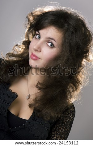 Image of a beautiful brunette model girl with curls