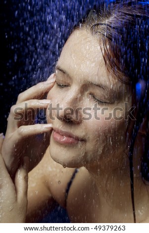 Images of a beautiful girl in the water and spray