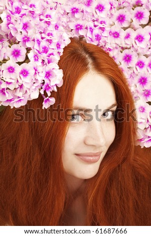 The image of a beautiful girl with flowers in her hair
