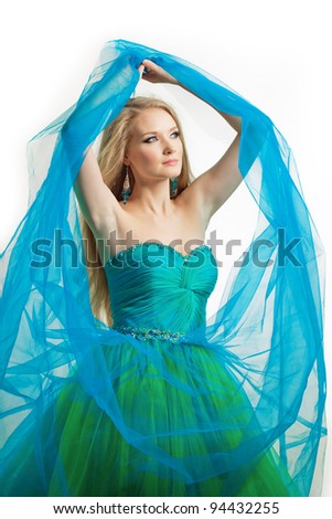 Stylish woman in a blue dress on a white background