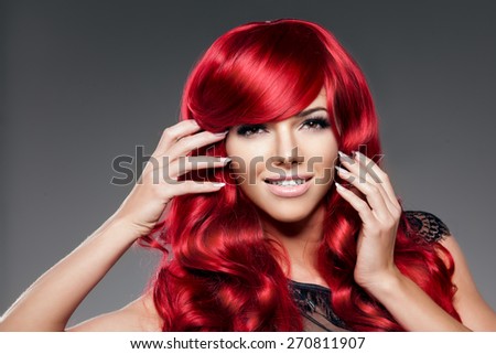 Luxury fashion trendy  young  woman with red curled hair. Girl with beauty hairstyle. Model with long stylish  bangs, wave, curly hair. Lady with a beauty face