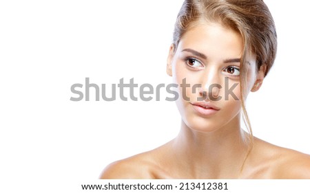 Young woman with clear face natural make up her hair up on a white background