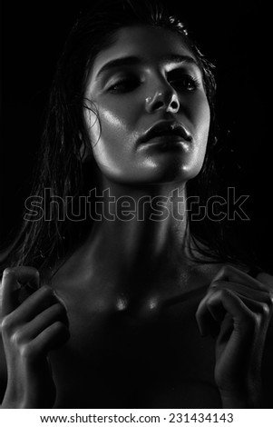 Trend beauty at the studio model with wet face skin and hair shooting in black and white