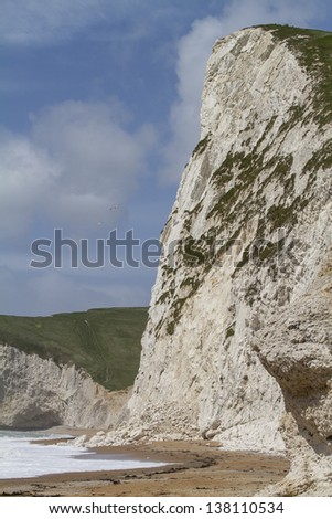 Rock fall from a chalk cliff onto the beach below at Durdle Door, Dorset, UK part of the World Heritage Jurassic Coast