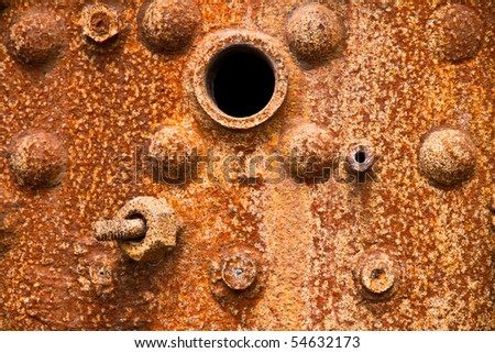 Close up of a heavily corroded old steam boiler