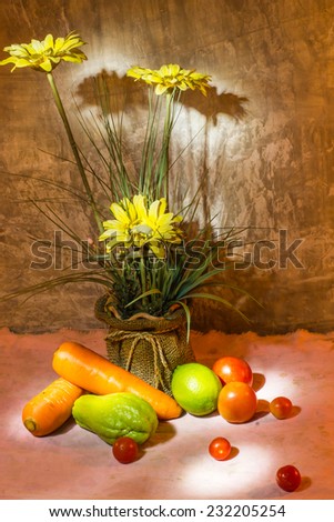 Beautiful still life with flowers and organic vegetables and fruit