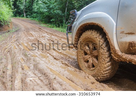 car tires in dirt road