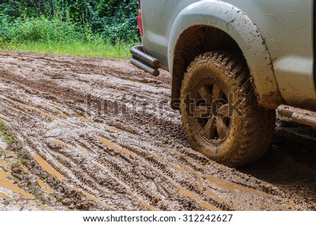 car tires in dirt road