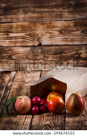 fruit in the package on a wooden background