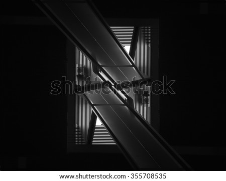 Double exposure closeup of contemporary interior detail. Black and white image of modern architecture in darkness.