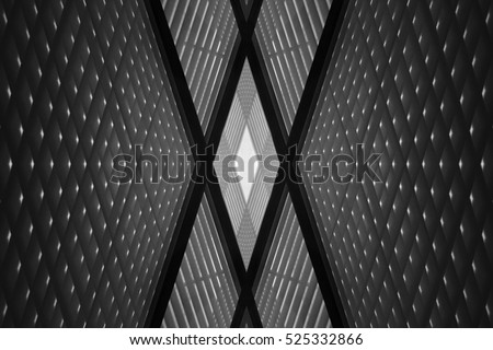 Double exposure photo of sloped walls. Realistic though unreal office interior fragment. Abstract black and white image on the subject of modern architecture.