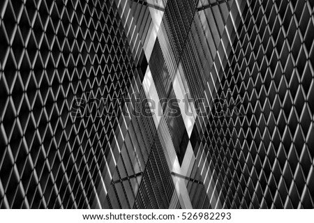 Double exposure photo of louvered wall. Realistic though unreal industrial or office interior in hi-tech / minimalism style. Abstract black and white image on the subject of modern architecture.