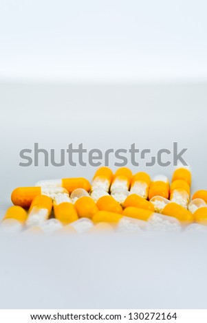 Group of yellow-white pills on the plate