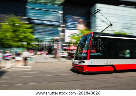 Modern tram blurred in motion in the Prague city, Europe